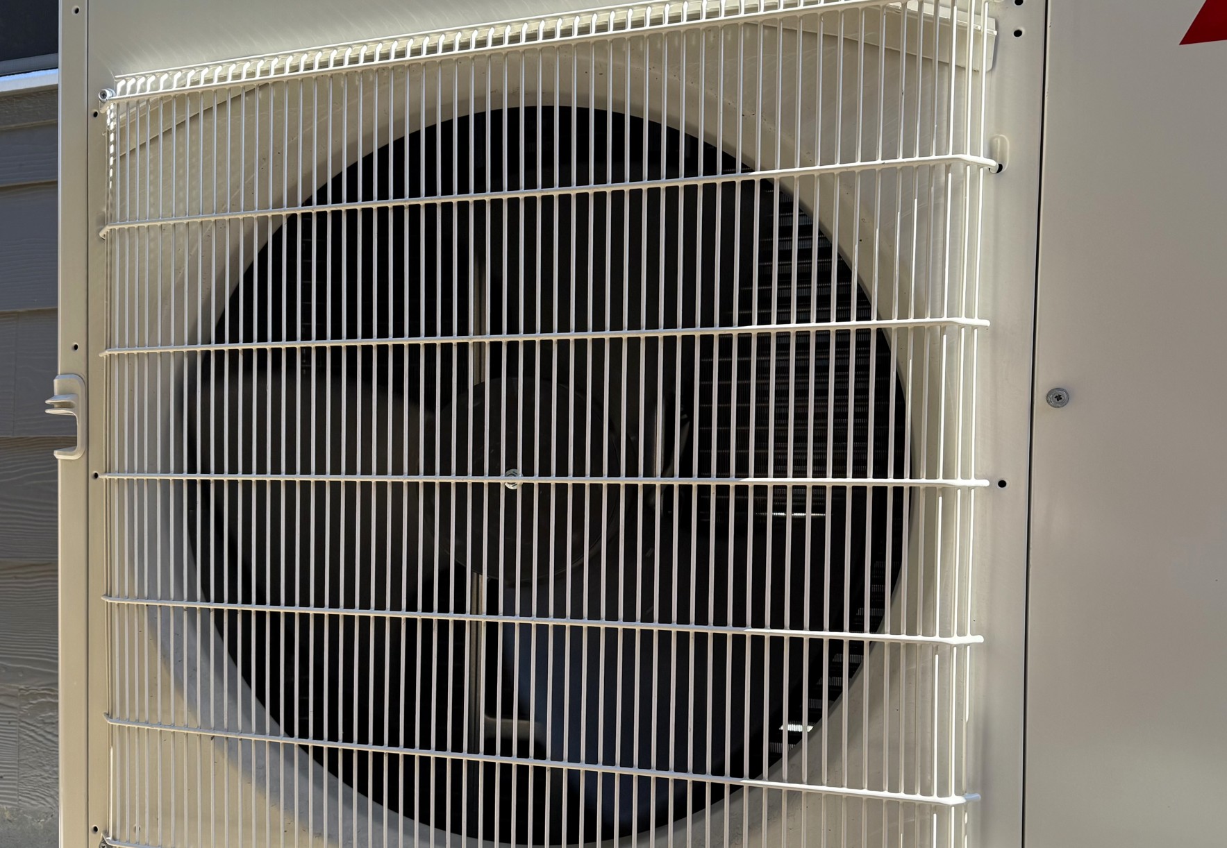 HVAC technician performing fall maintenance on furnace in Colorado home